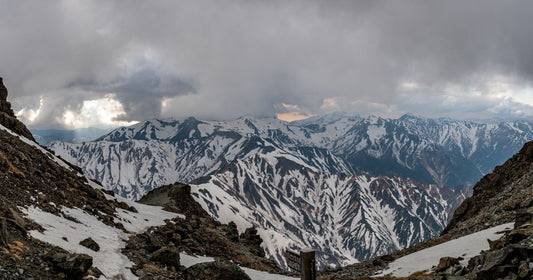 Geological rock layers in high mountain regions where shilajit forms